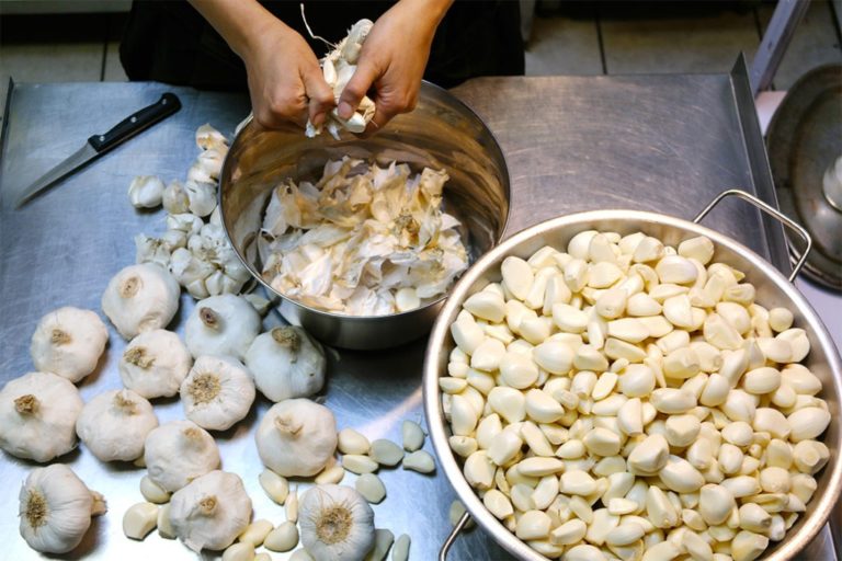 Peeling garlic for the chimichurri